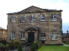 The Wesleyan Chapel, built in 1807 and now known as the Central Methodist Church, is the oldest currently used place of orthodox Christian worship in Belper. The building is set back from the A6 in its own large graveyard, now a pleasant garden. When first built the chapel was described as 'the wonder of the country for many miles around' on account of its great size. It is now a listed building. The congregation grew out of the first smaller chapel (see next slide). The new building, which was opened on June 28th 1807, cost £3000 to build and it could accommodate 1400 worshippers. It was an ambitious project which used mill props to hold up the horseshoe shaped gallery which was pewed. The ground floor had forms for the use of the large Sunday School. The Pulpit was high up on the west wall and below it was a large “singing pew” for a choir and band. A school room was added at the rear in 1841 and in 1873 the ground floor was pewed, the large Victorian pulpit erected, a new organ added and the present porch built. 