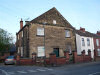 Another Methodist Chapel exists at the corner of Quarry Lane with Holbrook Road, Belper. Confusingly this also seems to have been called Zion Primitive Methodist Church; it is now a private residence known as 2 Chapel Mews. This Church was founded before 1880, although the plaque on the gable is not readable. It is marked on the 1880 OS map as 'Methodist Chapel (Primitive) (Seats for 250)', and at that time stood in isolation on the corner of a road named 'Back Hollow'. It is now a listed building. Kelly's Directory of 1932 records that Belper had two Primitive Methodist Chapels, one at Field Head and the other at Cow Hill. This doesn't appear to fit the description of either of them! 